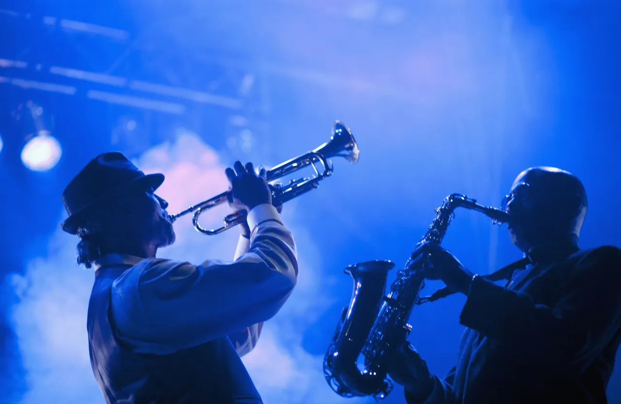 a couple of black men playing musical instruments. Heavy rain. Dense fog. Film Noir. Film grain texture. Bleak colors. 30-s Prohibition era street.