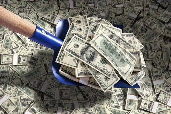 a pile of money with a blue handle