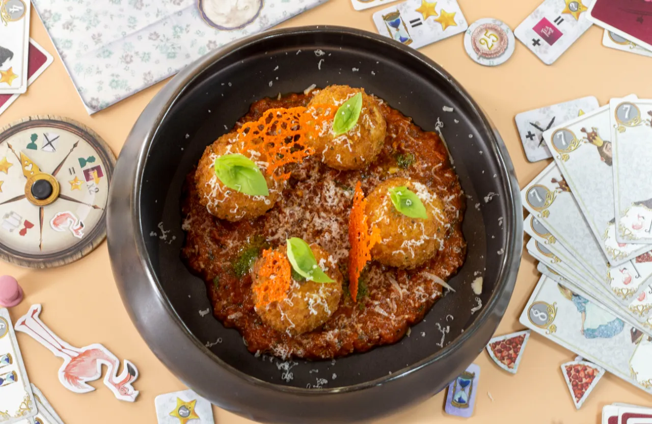 a black bowl filled with food on top of a table and smoke is coming out of the bowl