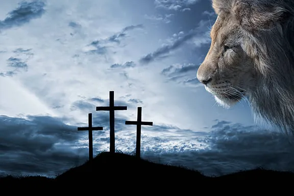 a lion standing in front of three crosses