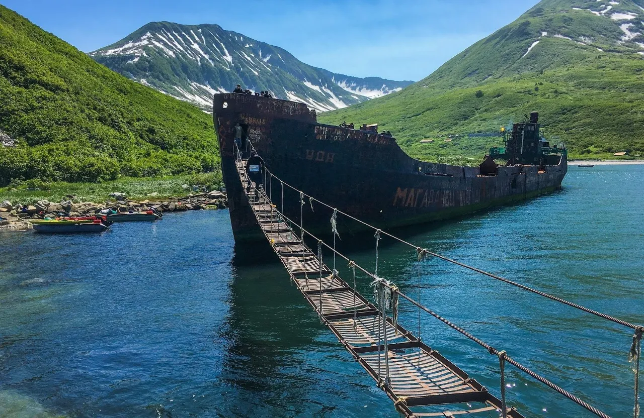 a large boat is being pulled across a body of water