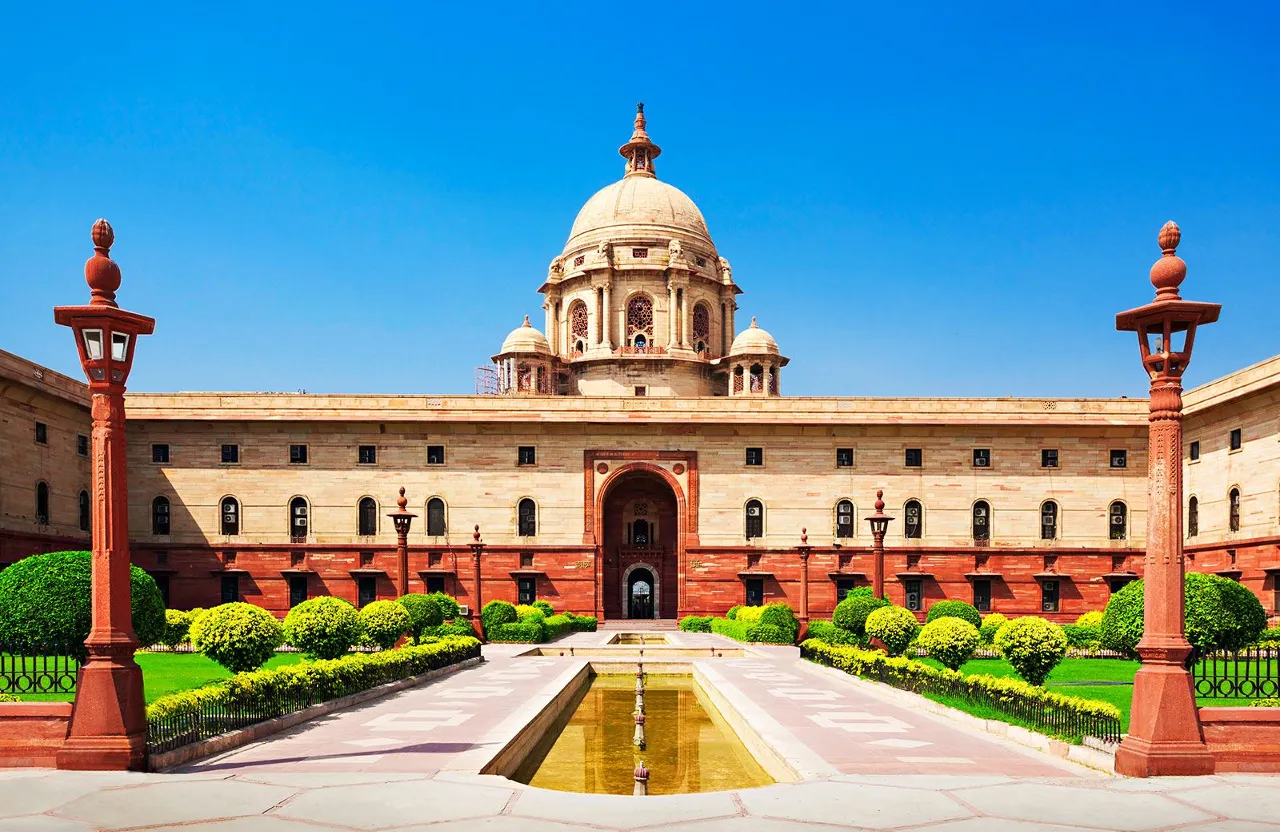 a large building with a fountain in front of it