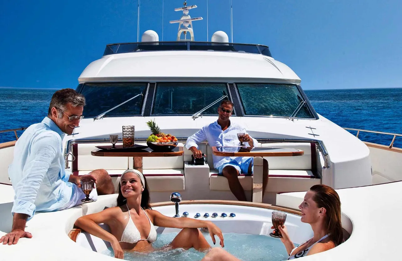 a group of people sitting in a hot tub on a boat