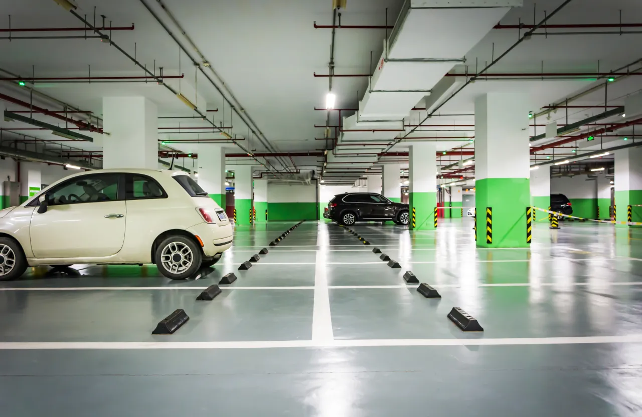 a white car parked in a parking garage