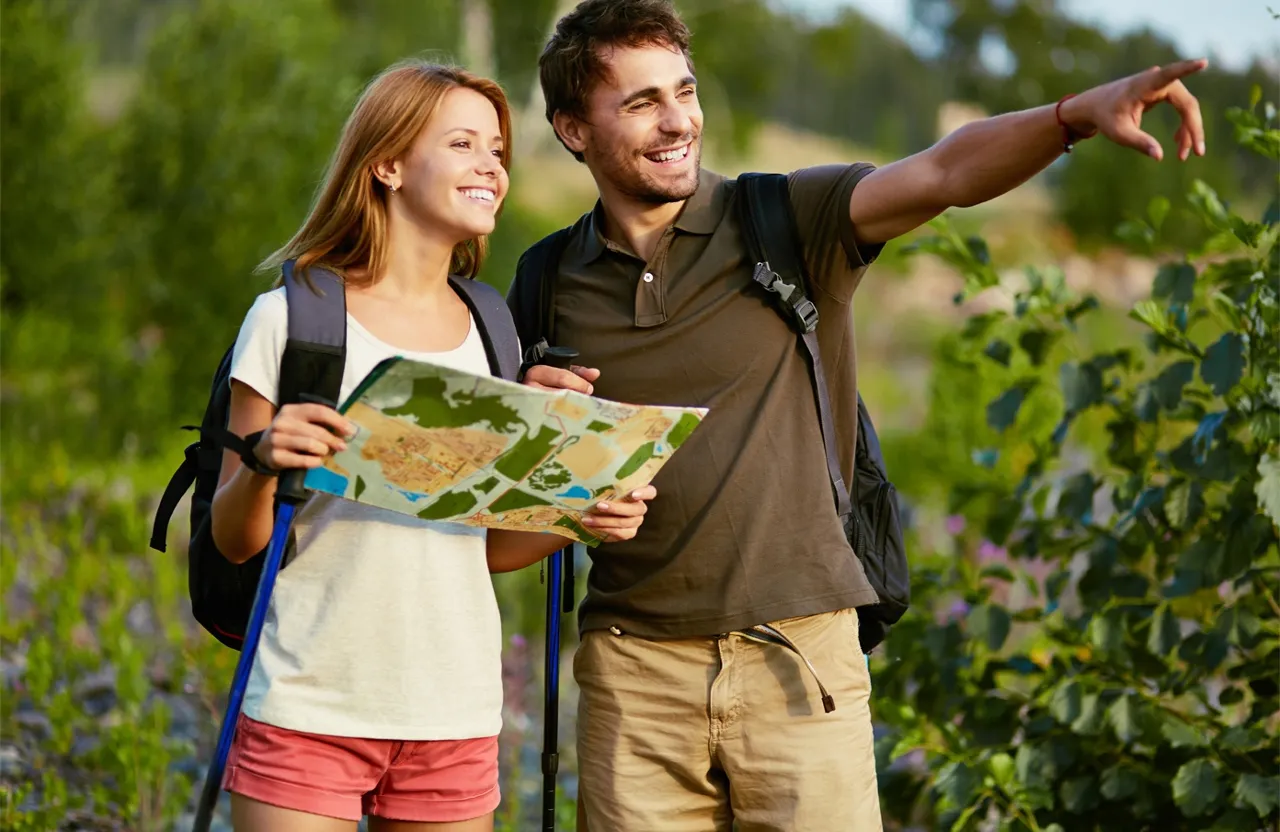 a man and a woman looking at a map