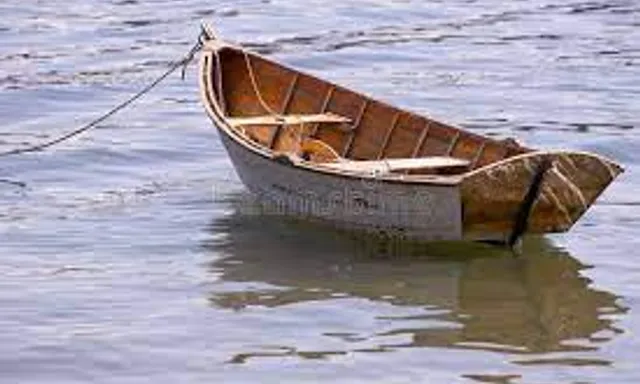 a small boat sitting on top of a body of water