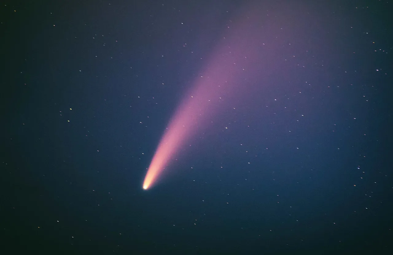 a comet is seen in the night sky