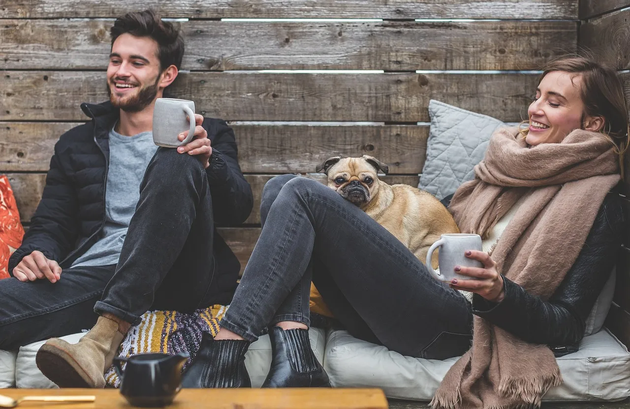 cartoon animated style of a man and a woman sitting on a couch with a dog