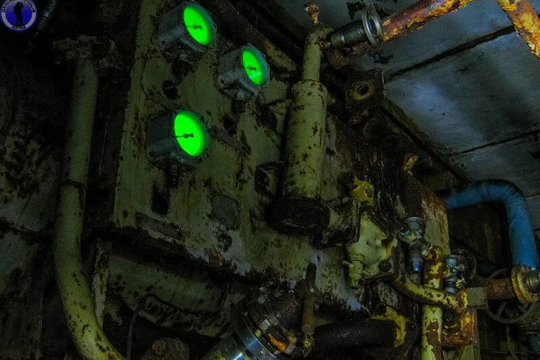 a large machine with green lights on the side of it