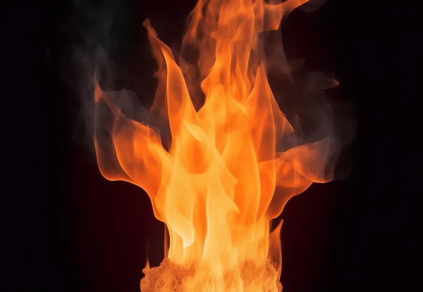 a close up of a fire on a black background