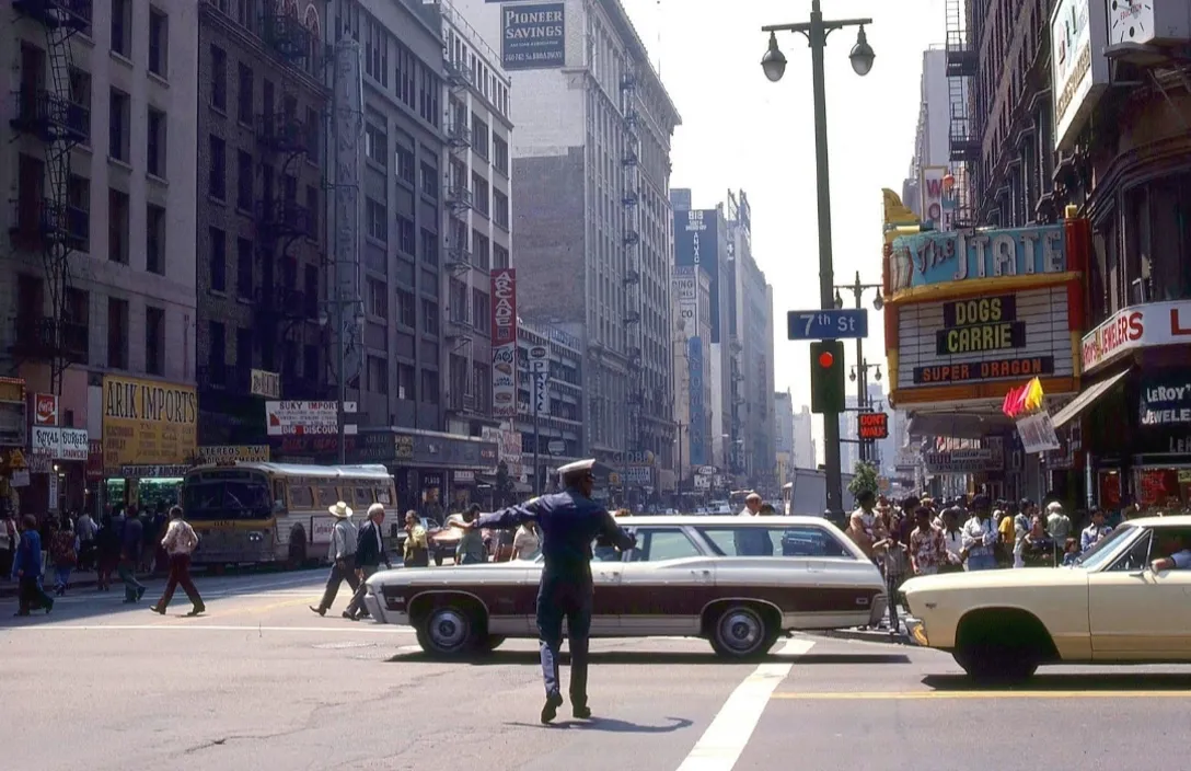 a cop directing traffic on a busy city street