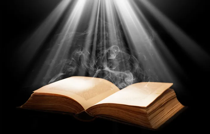 an open book with smoke coming out of it