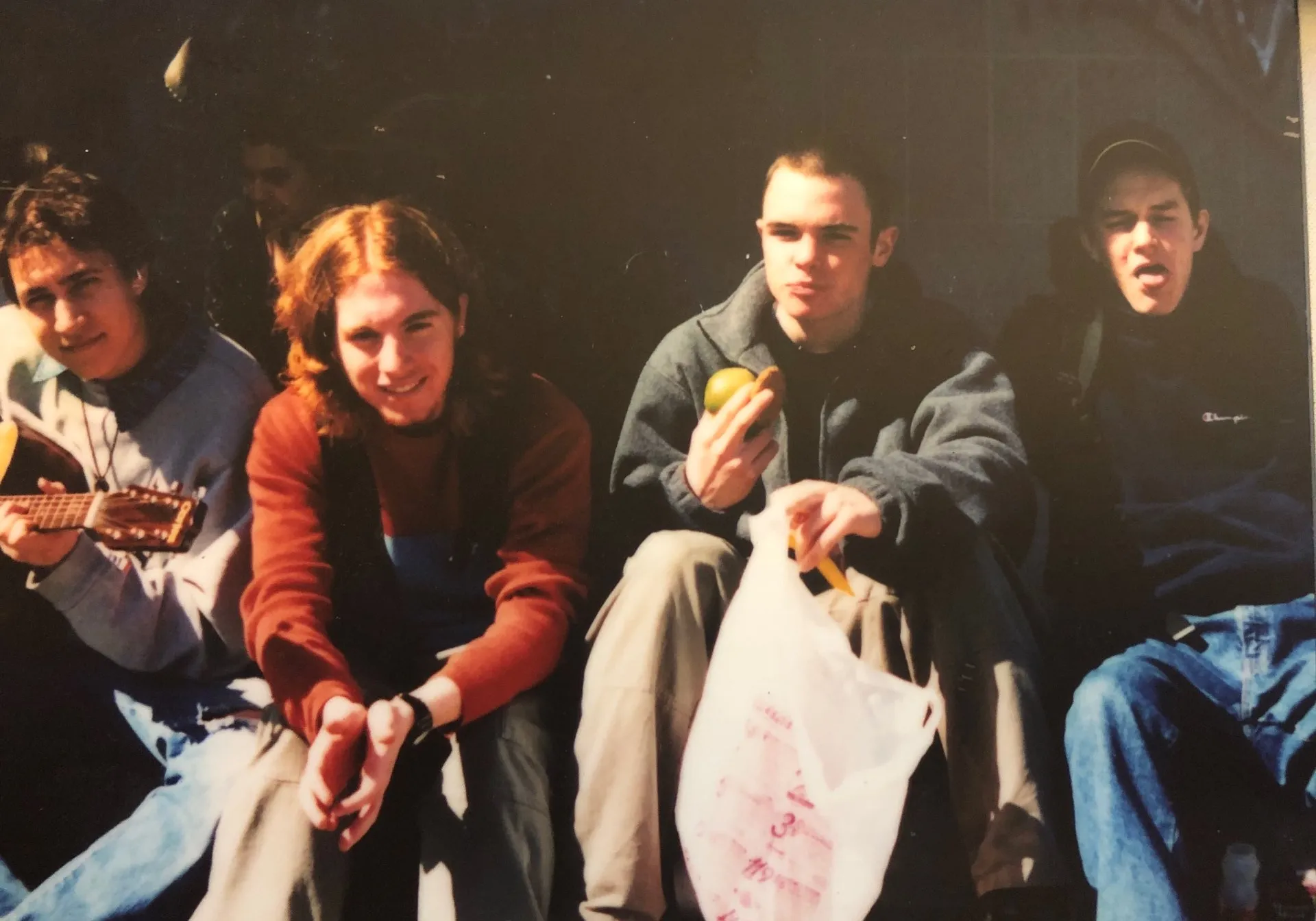 friends at school eating lunch, playing guitar, having fun, smiling, advertising style