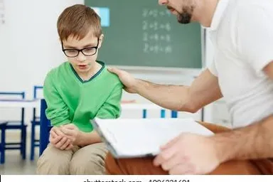 a man helping a young boy and give a water