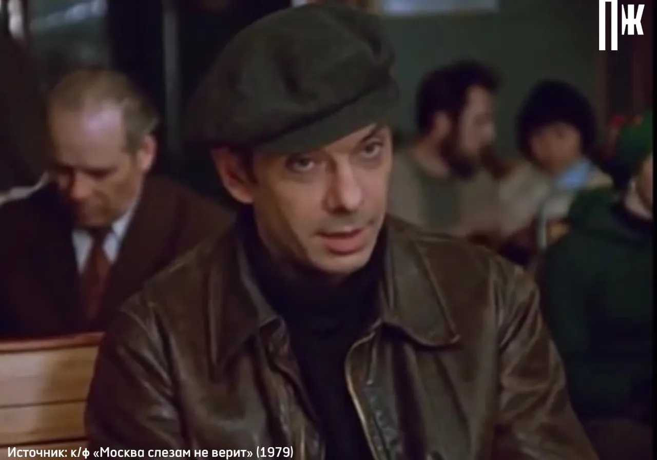 a man in a brown leather jacket and hat