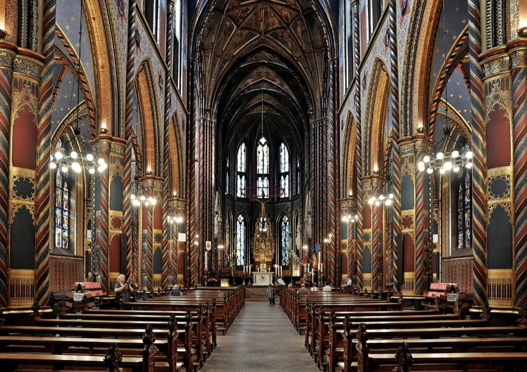 a large cathedral filled with lots of wooden pews