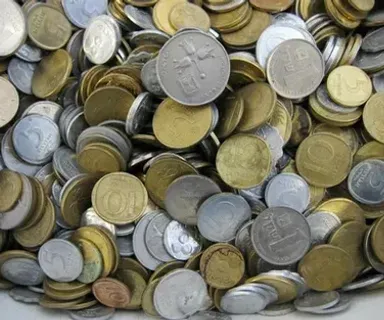 a pile of coins sitting on top of a table