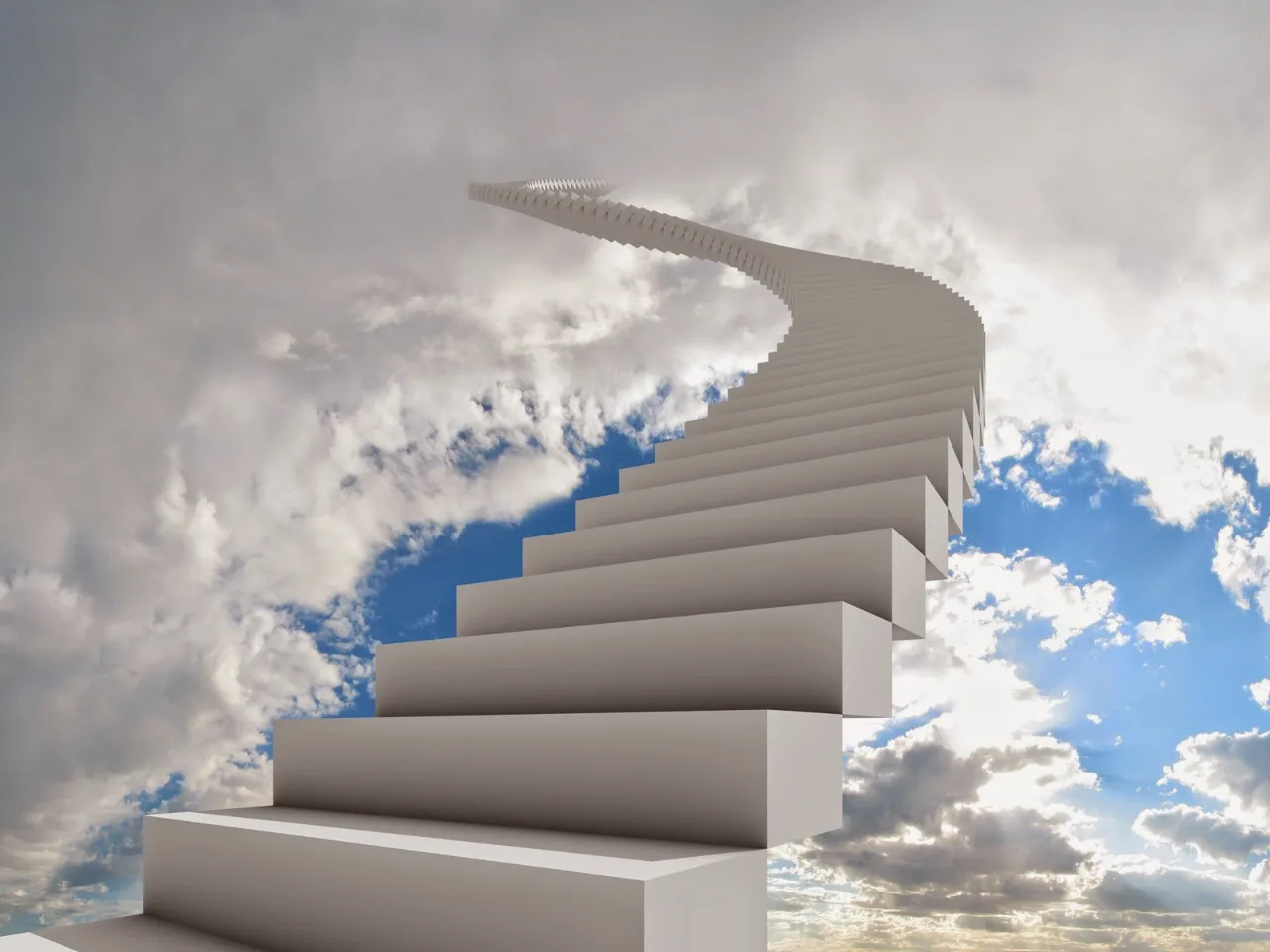 a staircase leading to a sky with clouds