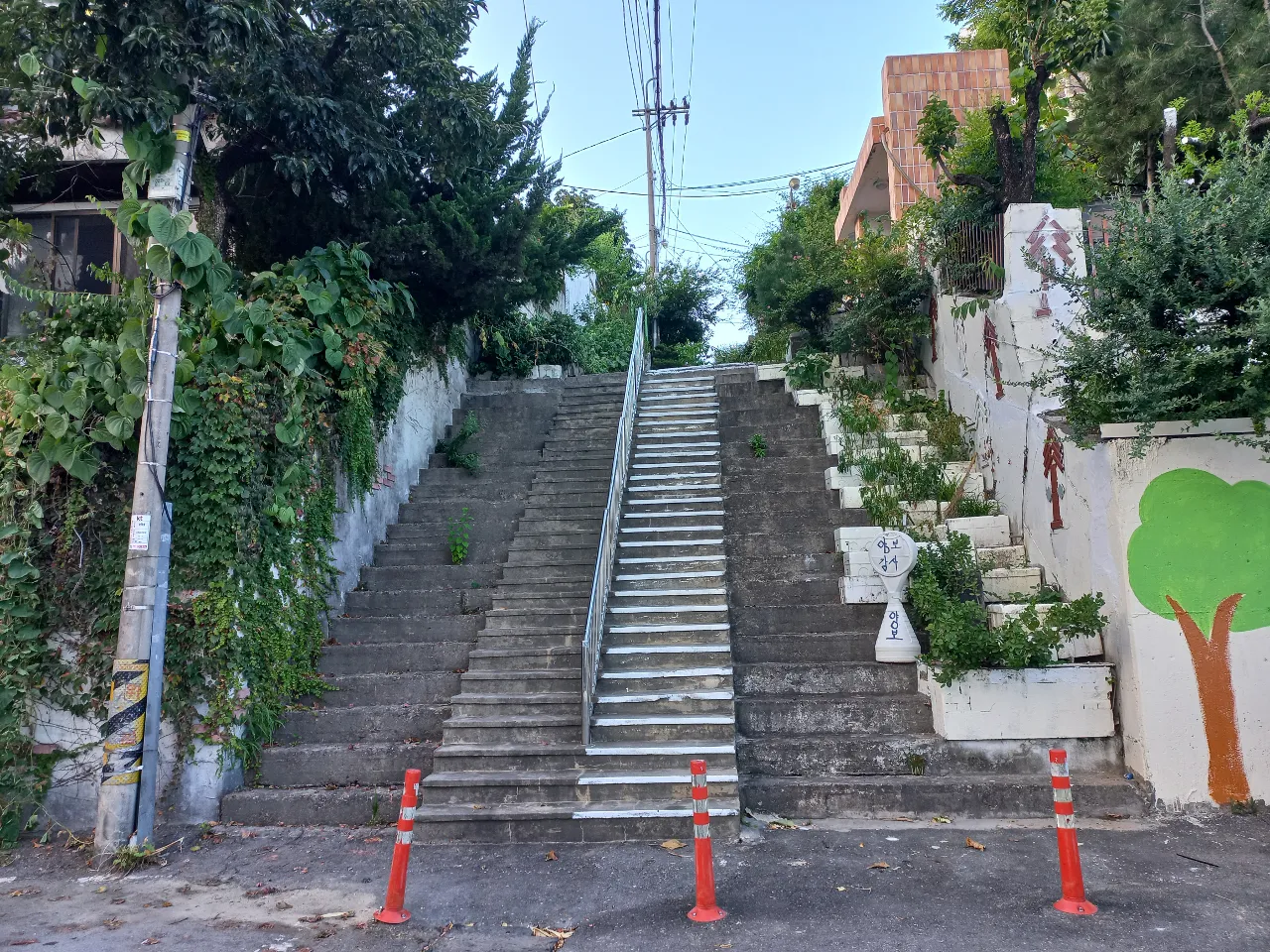 a set of stairs with a tree painted on it