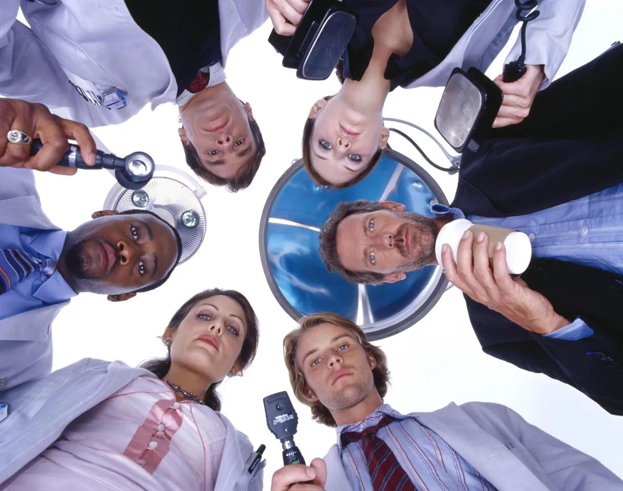 a group of business people standing in a circle