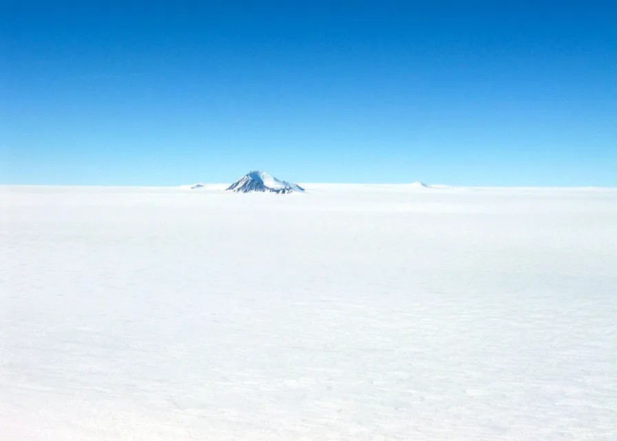 a view of a snowy mountain in the distance