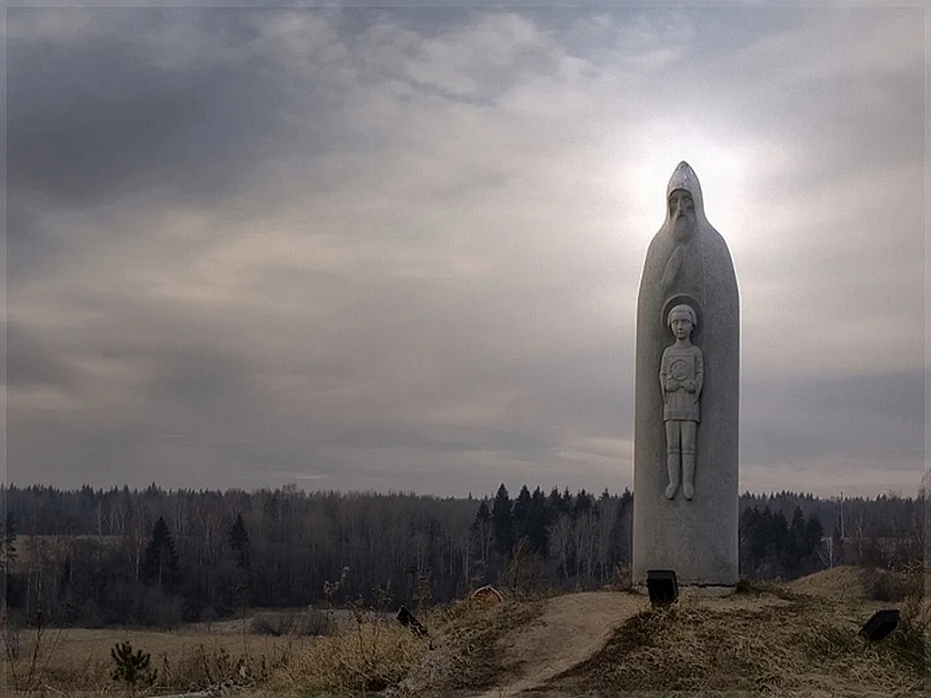 a statue of a person holding a baby in a bottle