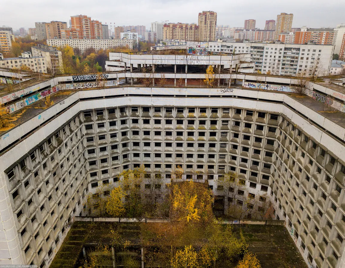 an aerial view of an abandoned building in a city