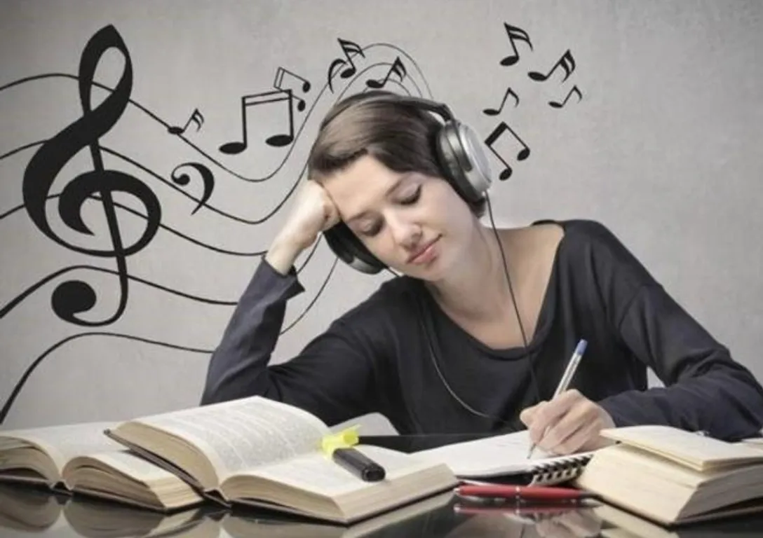 Students listening to music while studying, with symbols of memory and creativity around them.