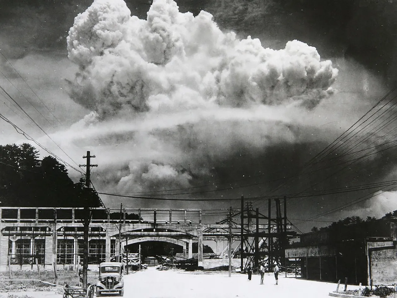 a black and white photo of a large cloud of smoke