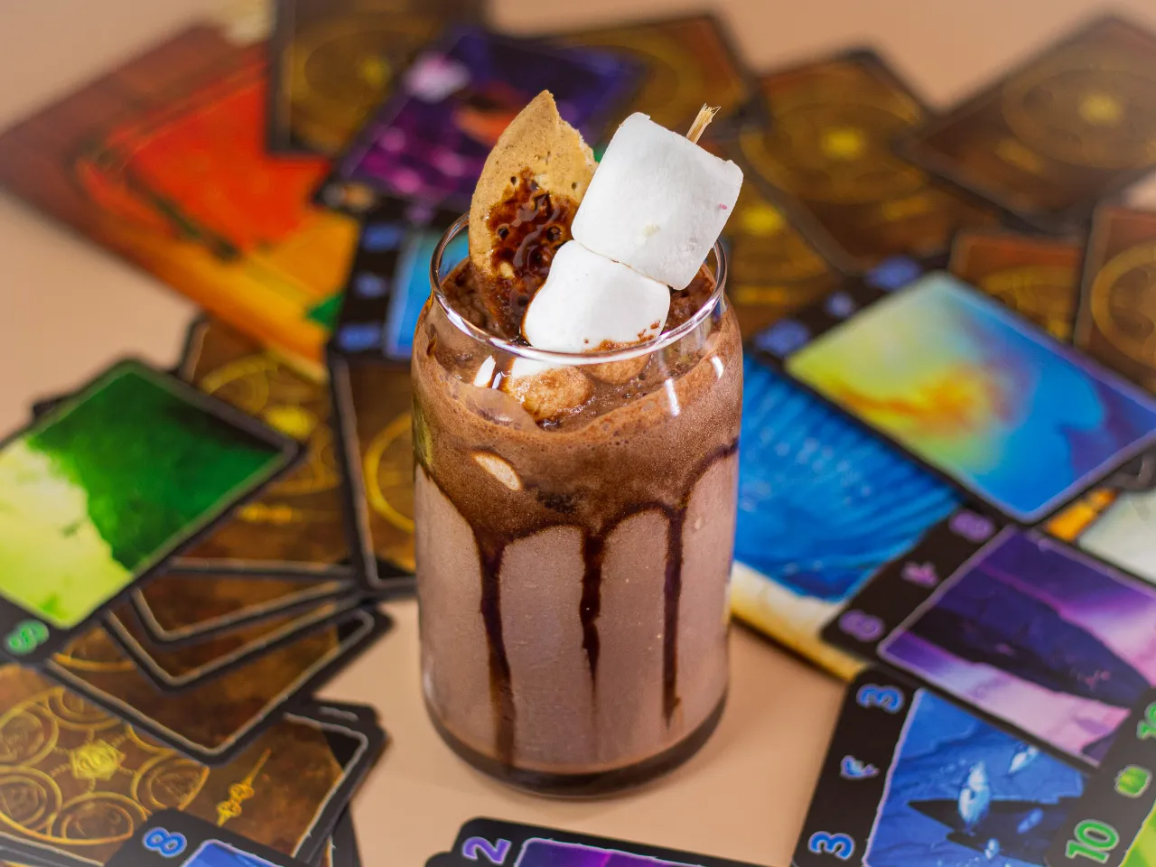 a chocolate drink with marshmallows on top of it rotating in the middle of the road in a hot summer in desert
