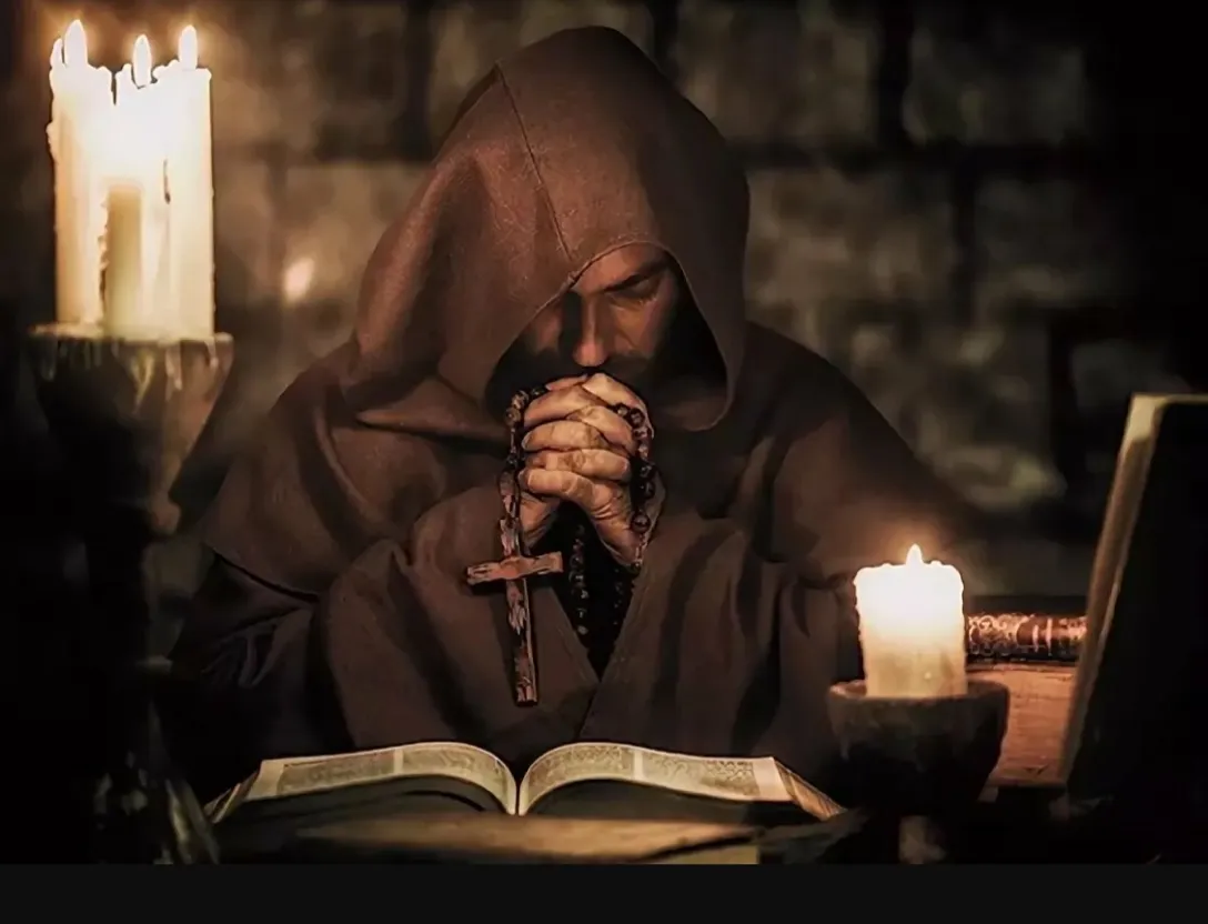 a nun holding a cross and praying in front of a book