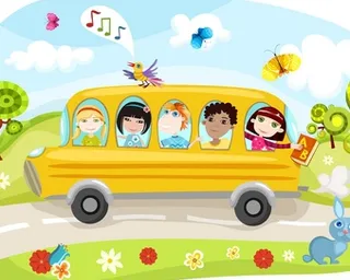 a school bus filled with kids riding down a road