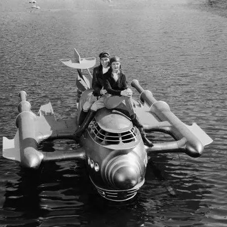 a couple of people that are on a plane in the water