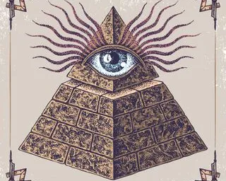 a pyramid with an eye on top of it