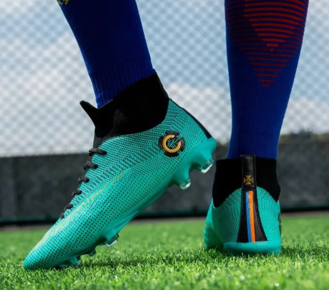 a close up of a soccer shoe on a field