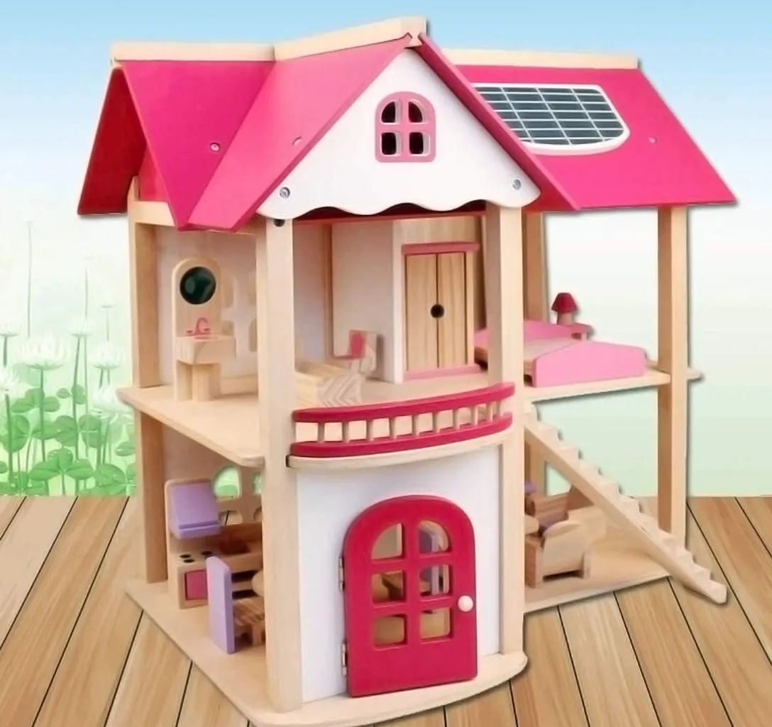 a doll house with a pink roof and a pink door