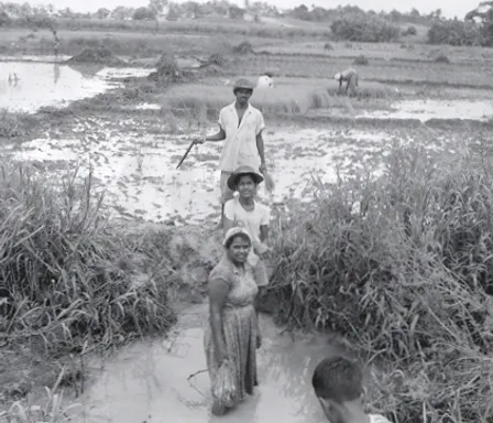 a black and white photo of a group of Indian people