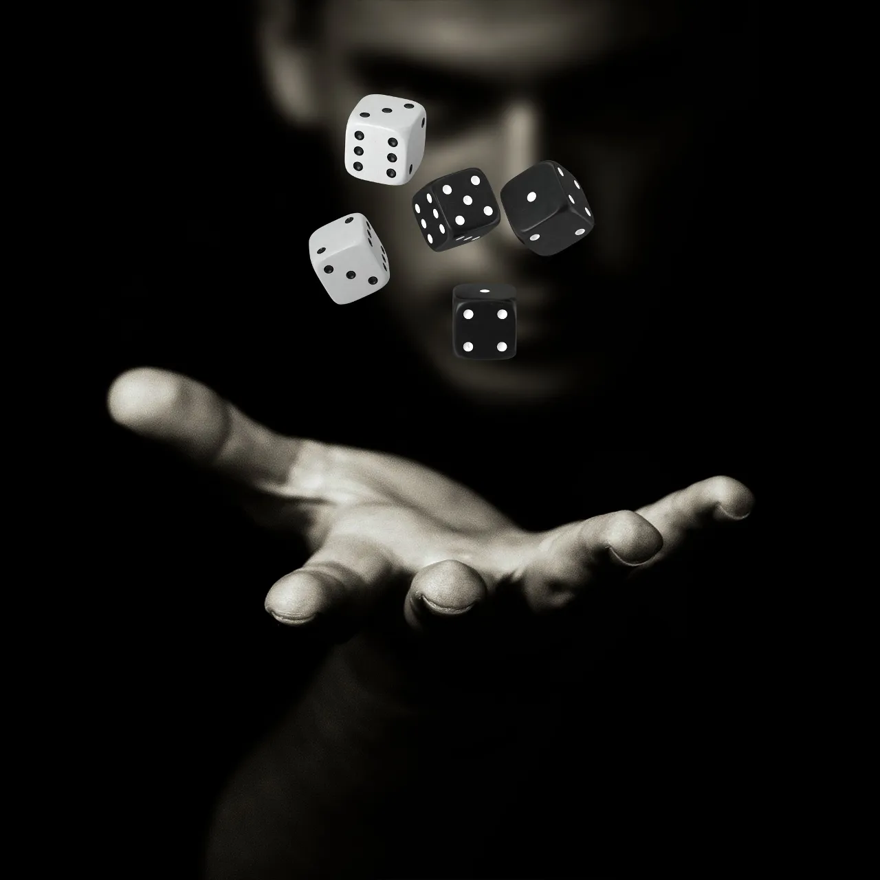 a man is throwing dices into the air