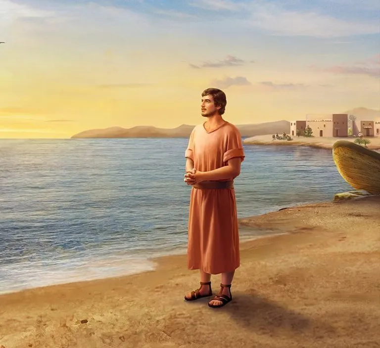 a man standing on a beach next to a boat