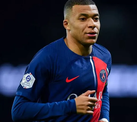 Mbappe in a blue shirt