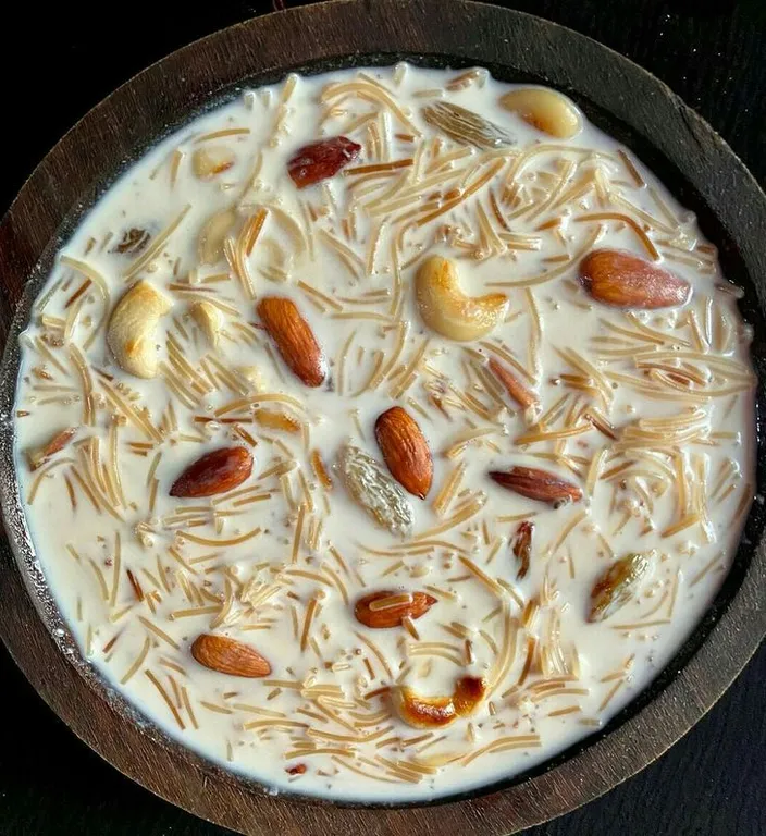 a pan filled with a mixture of nuts and cream