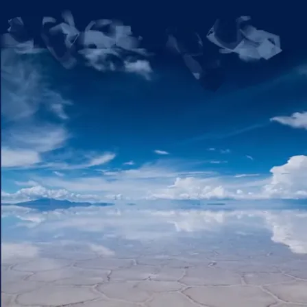 a blue sky with some clouds and some water