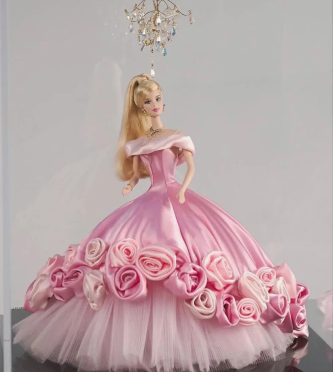 a barbie doll is wearing a pink dress