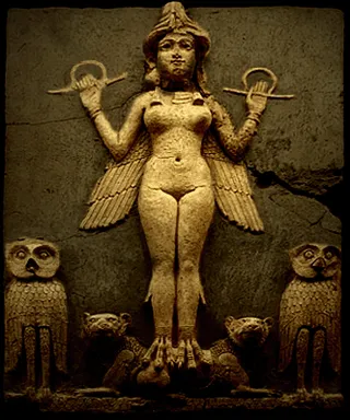 a statue of a woman surrounded by owls