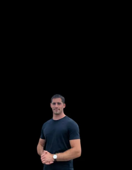 a man standing in front of a black background