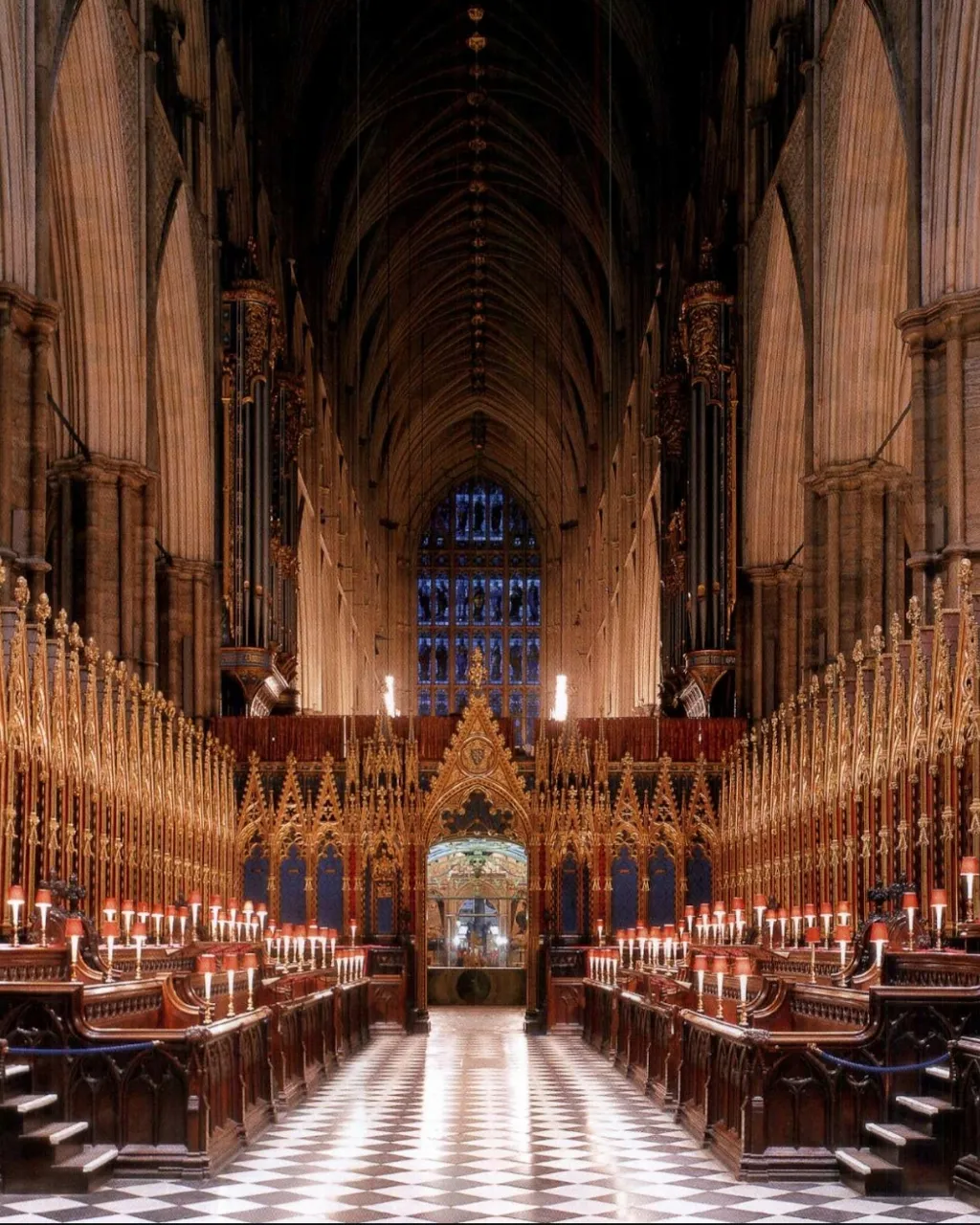 a large cathedral with a checkered floor and a large organ