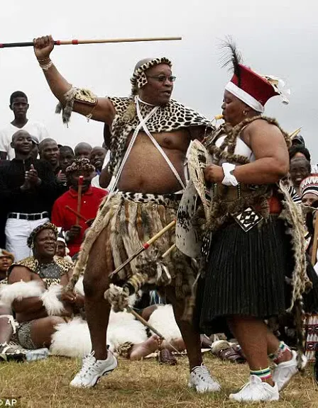 a group of people dressed in native zulu african skins and traditional zulu attire