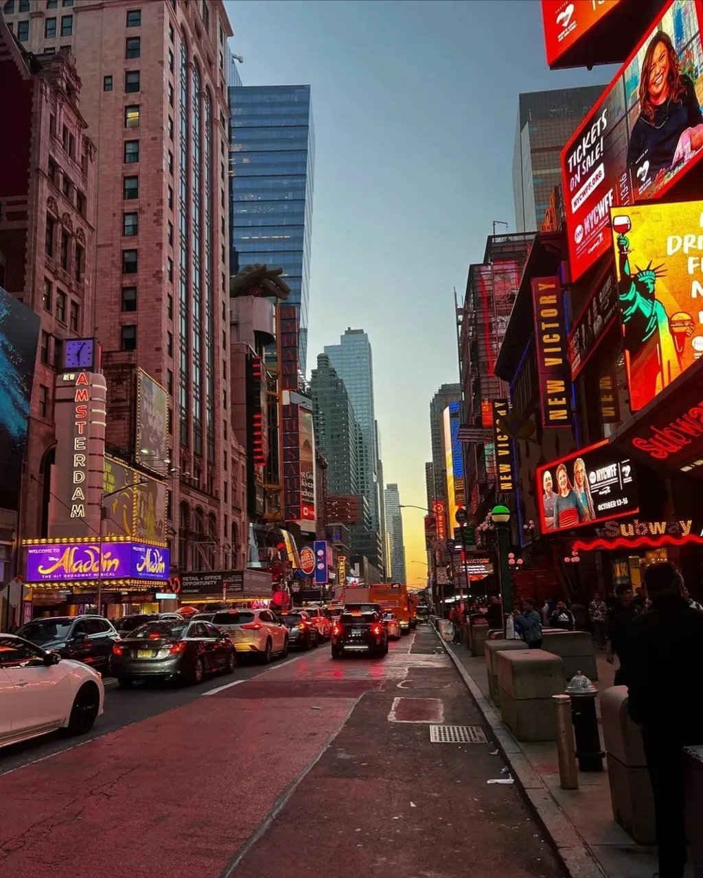 a city street filled with lots of tall buildings