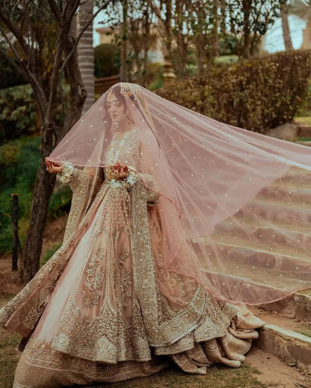 a woman in a wedding dress with a veil