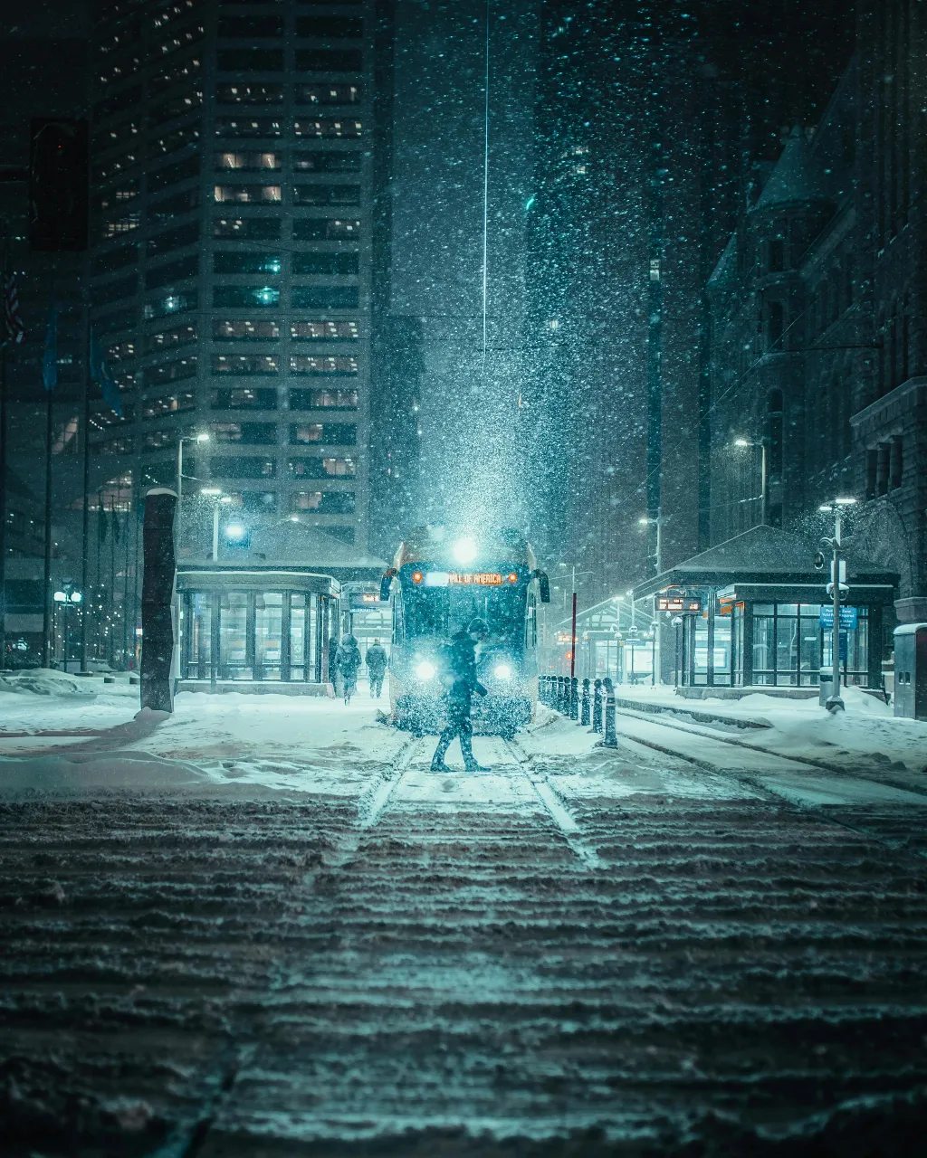 a train traveling down a snow covered train track